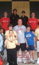 Wolfpack netters pose with the Wake County Special Olympics group.