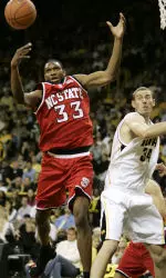 Cedric Simmons fights for a rebound with Iowa's Erek Hansen.