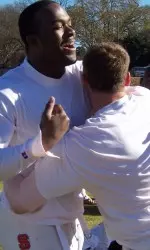 Mario Williams and Marcus Stone wrestle. Meineke Bowl Practice.