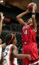 Tiffany Stansbury shoots over Miami's Imani Dhahabu and Fallon Phanord.
