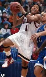 Khadijah Whittington drives to the basket around Middle Tennesse forward Tia Stovall during the second half.