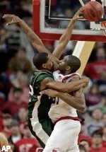 Ced Simmons goes for the block.