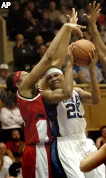 Duke's Monique Currie (25) is blocked by Gillian Goring (5) in the first half. (AP Photo/Sara D. Davis)