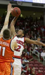North Carolina State's Tony Bethel drives for a dunk as Virginia's Laurynas Mikalauskas defends during the first half. (AP Photo/Gerry Broome)