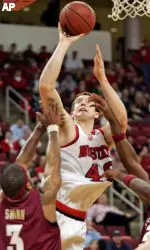 Andrew Brackman shoots over Florida State's Isaiah Swann (3) in the first half. (AP Photo/ Karl DeBlaker)
