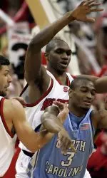 North Carolina's Reyshawn Terry loses the ball as he is trapped by Ilian Evtimov and Cedric Simmons.