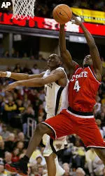 Coutney Fells reaches for a rebound next to Wake Forest's Cameron Stanley during the second half. (AP Photo/Chris Keane)