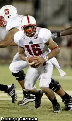 Russell Wilson looks to hand off in the backfield.