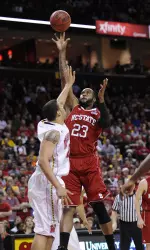 North Carolina State forward Tracy Smith (23) takes a shot pver Maryland forward Jordan Williams, left, during the first half.