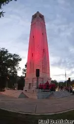 Memorial Belltower is lit Red for the Pack baseball team before they head to the NCAA Gainesville (Fla.) Super Regional.