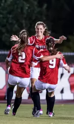 Proper celebrates with teammates following her equalizing goal in the 17th minute