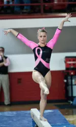Junior Hannah Fallanca performing her routine on beam