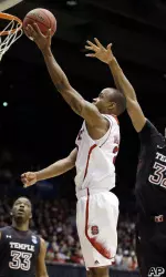 Lorenzo Brown drives past Temple forward Rahlir Hollis-Jefferson.