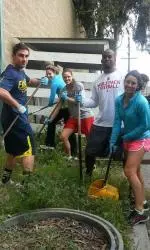 Asa Watson helping clean up a playground