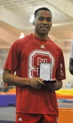 Jonathan Addison accepting his silver medal after finishing second in the long jump at the 2014 ACC Indoor Championship.