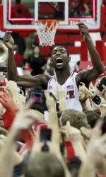 Fans rushed the court at PNC Arena after NC State's win over #1 Duke in 2013.