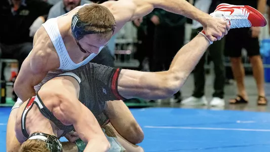 Evan Wick controls Shane Griffith of Stanford.