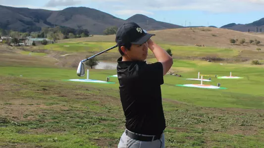 Nicholas Mok follows his drive.