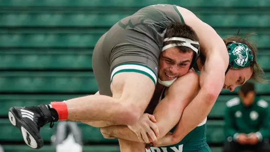 Nathan Tausch lifts his opponent off the mat.