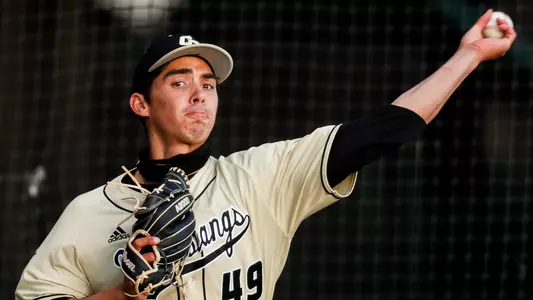 Andrew Alvarez throws a pitch.