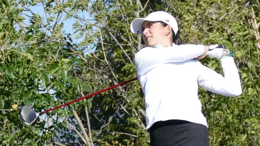 Nicole Neale watches her drive.