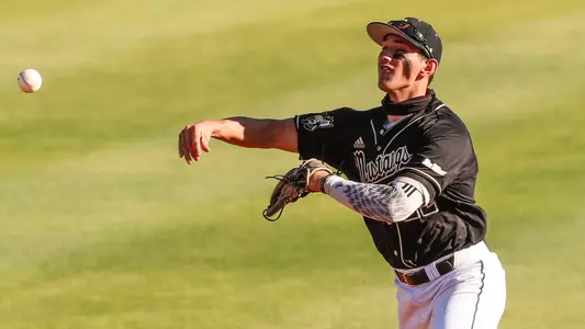 Brooks Lee throws out a baserunner.