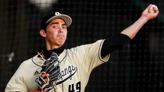 Andrew Alvarez throws a pitch.