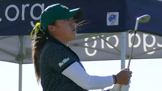Vanessa Wang follows her tee shot.