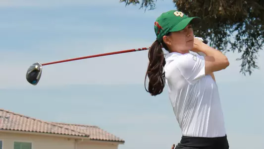 Nicole Neale watches her drive.