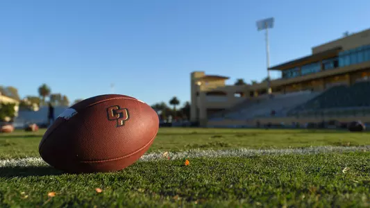 Football on grass at Spanos Stadium