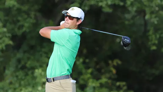 Joey Zambri follows his tee shot.