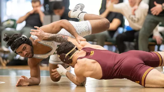 Dom Demas battles Minnesota's Michael Blockus for control.