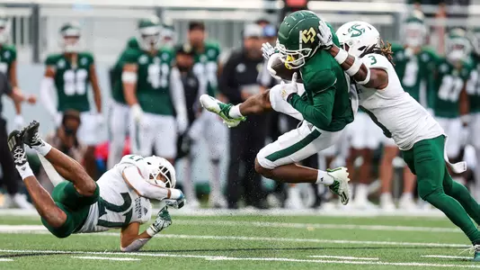 Chris Coleman gains extra yards after a catch against Sacramento State.