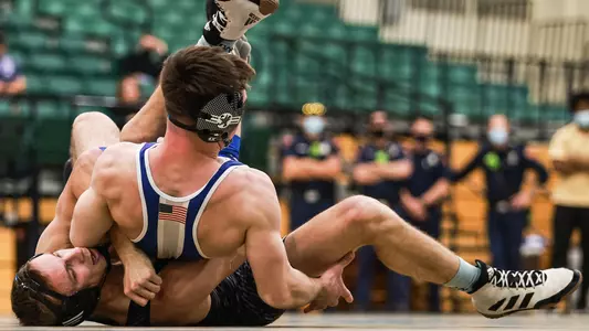 Evan Wick works to pin his Air Force opponent.