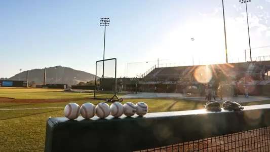 Balls await use in Cal Poly baseball game.