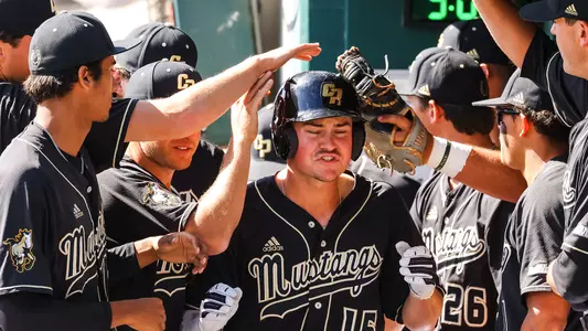 Matthias Haas is greeted in dugout after a home run.
