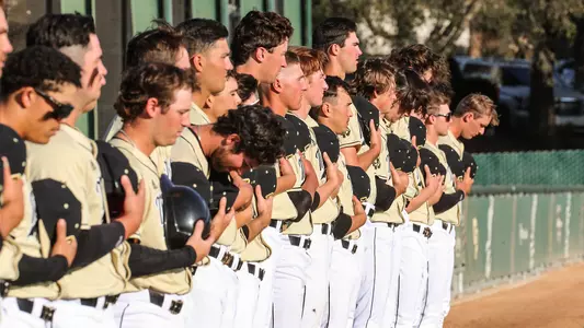 Cal Poly players lineup for National Anthem.