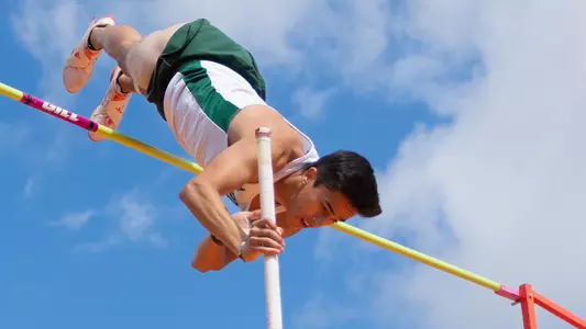 Christian Valles competes in pole vault.