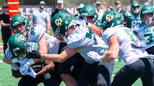 Zion Hall is gang tackled during Spring Game in March.