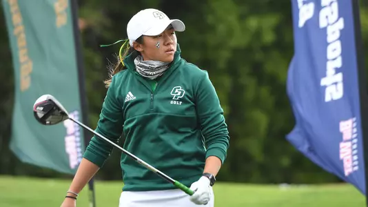 Vanessa Wang follows her tee shot.