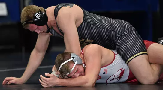 Trevor Tinker wrestles against North Carolina State.