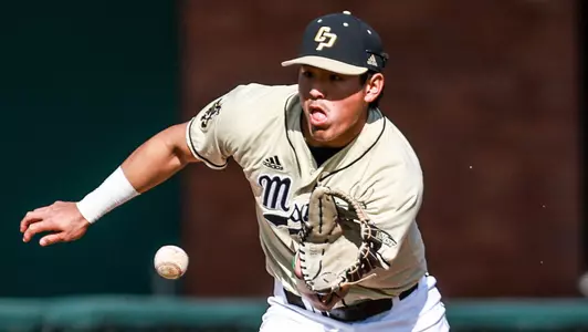 Tate Shimao fields a grounder at third base.