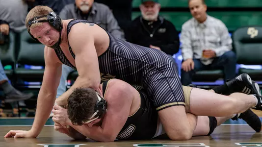 Trevor Tinker wrestles in December for Cal Poly.