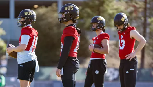 Cal Poly quarterbacks dressed in red jerseys this week.
