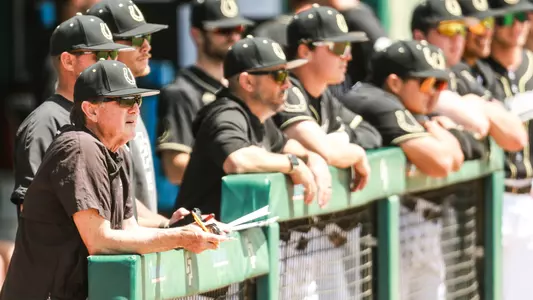 Larry Lee manages his Cal Poly baseball team from the dugout.