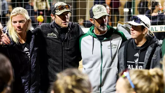 Joe Rich, second from left, at a team meeting following a recent match.