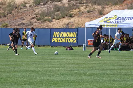 Adrian Jacobs brings ball up the field in the first half