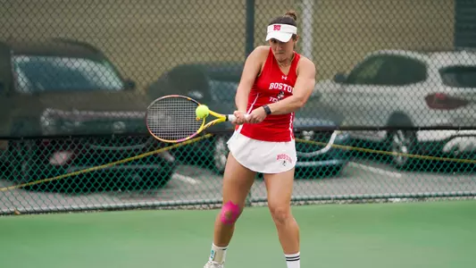Gabriella Mikaul hitting a backhand at the Patriot League semifinals