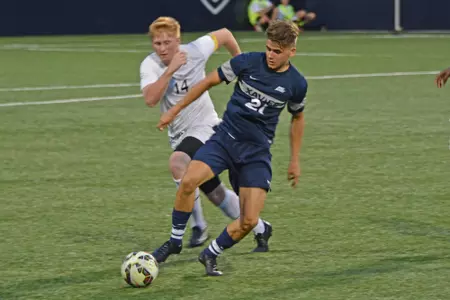 Majed Osman dribbles during an exhibition against Cincinnati State on Tuesday, August 18.