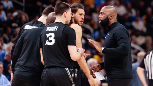 Isaac Chew with players